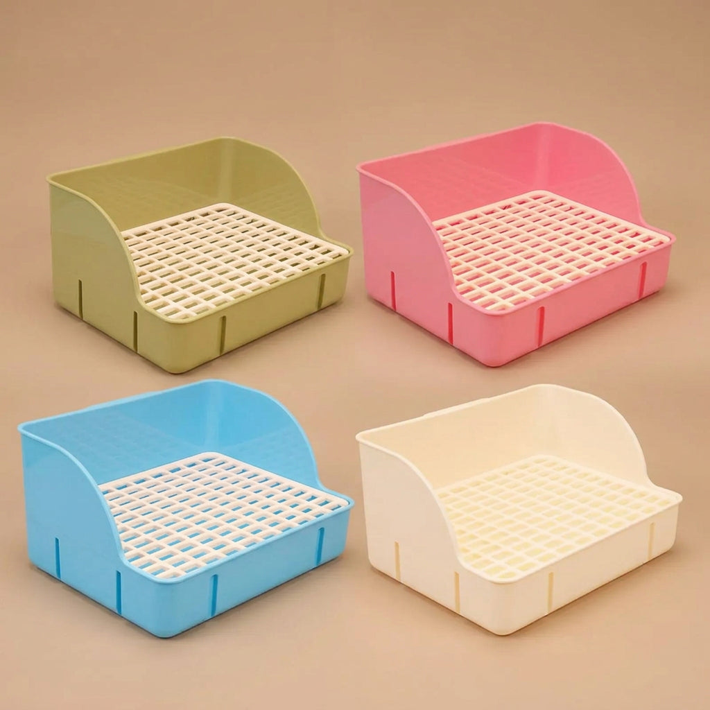 Four colorful pet litter boxes on a beige background