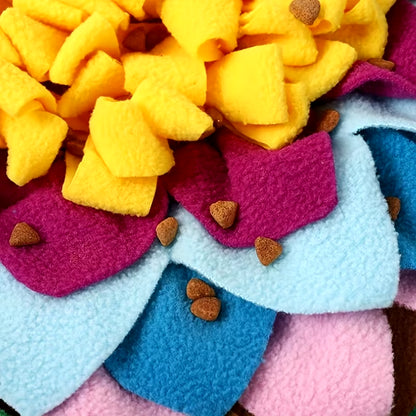 Close-up of colorful fleece fabric with heart shapes and small brown patches.