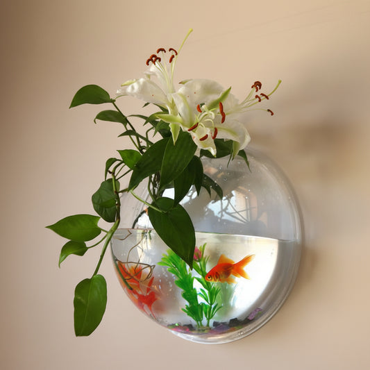 Decorative wall-mounted fishbowl with flowers and fish on a white background