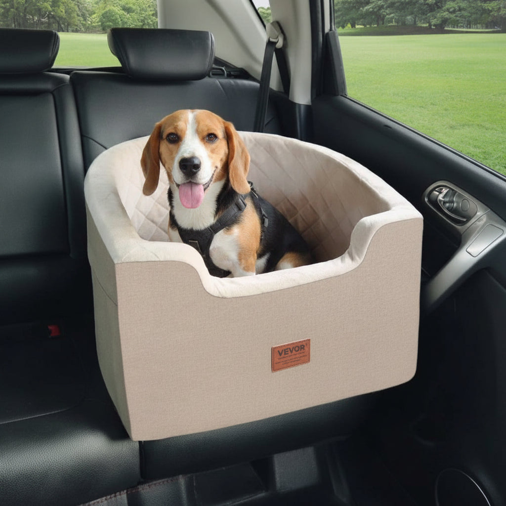 Dog sitting in a beige pet seat in a car with a green field outside.
