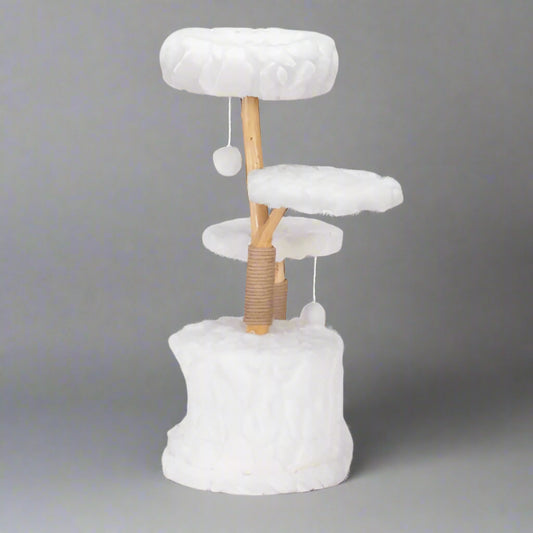 Cat tree with white cushioned platforms and a wooden post on a white background