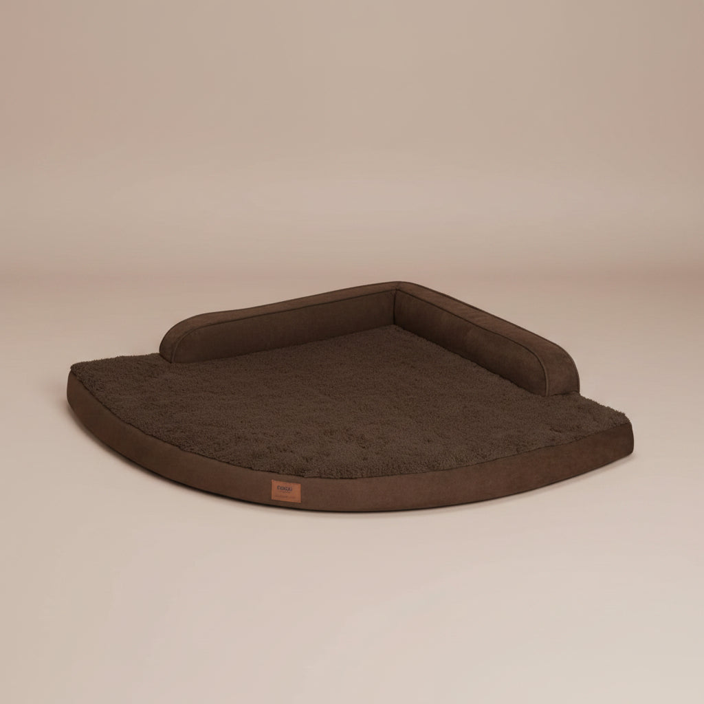 Image of a brown pet bed with a beige background.