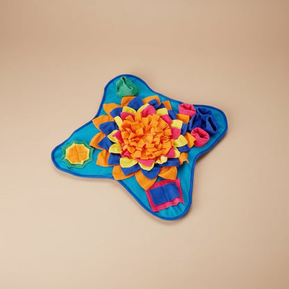 Colorful star-shaped toy with a floral design on a white background