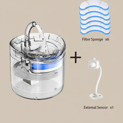 Clear water fountain with filter sponges and external sensor on a beige background